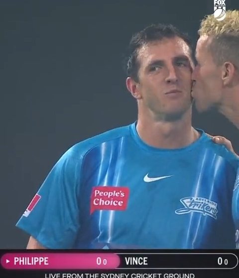 “Love Is In The Air”: Peter Siddle, kisses a teammate during a Big Bash League match.