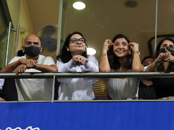 After a stunning one-handed catch to dismiss Rishabh Pant, Virat Kohli waves to wife Anushka Sharma.