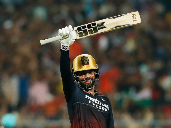 Rajat Patidar hits a six to reach a century in the IPL 2022 Eliminator.