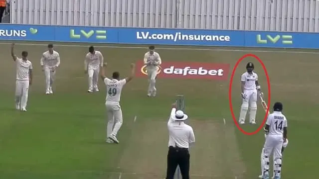 After being dismissed in a warm-up game, Virat Kohli questions the umpire.