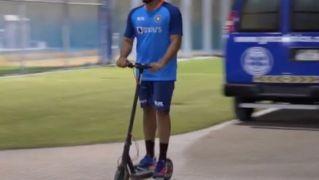 After practice, Rohit Sharma rides his kick scooter.
